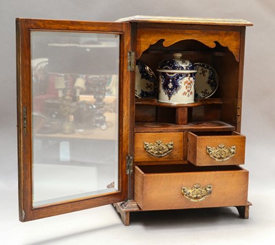 Lot 19 - A smoker's cabinet; two tea caddies; a...