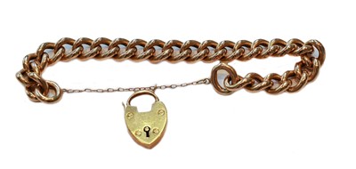 Lot 99 - A curb link bracelet, with a 9 carat gold...