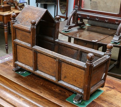 Lot 1342 - A 19th century oak dolls cradle, 46cm by 21cm...