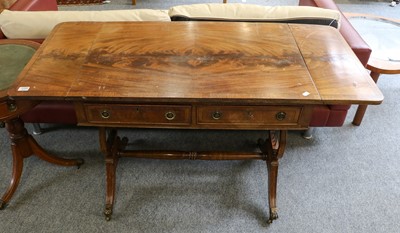 Lot 1295 - A reproduction crossbanded mahogany sofa table,...