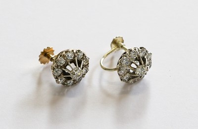 Lot 179 - A pair of diamond cluster earrings, with screw...