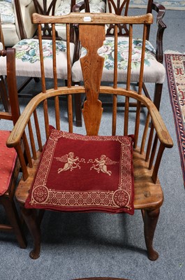 Lot 1183 - An ash and elm comb back windsor chair