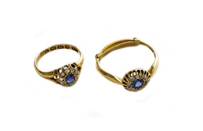 Lot 242 - An 18 carat gold sapphire and diamond cluster...