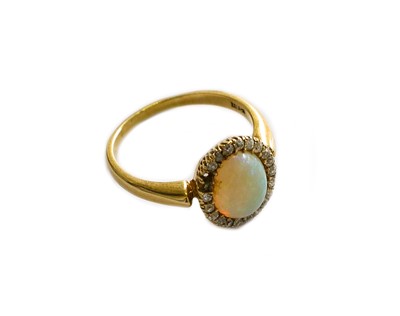 Lot 178 - An opal and diamond cluster ring, stamped...