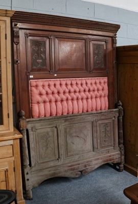 Lot 1131 - A carved walnut headboard and footboard, the...