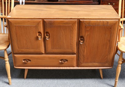 Lot 1195 - An Ercol light elm sideboard, 114cm by 44cm by...