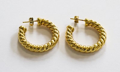 Lot 176 - A pair of 18 carat gold earrings, with post...