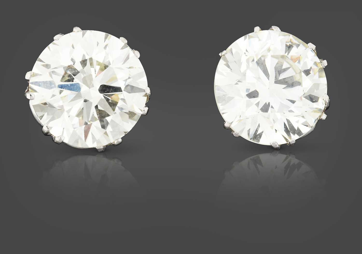 Lot 2350 - A Pair of Diamond Solitaire Earrings