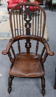 Lot 1163 - A 19th century ash and elm pad arm Windsor chair