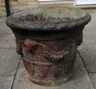 Lot 1100 - A brown glazed composition planter decorated...