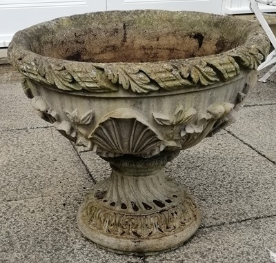 Lot 1105 - A composition pedestal planter decorated with...