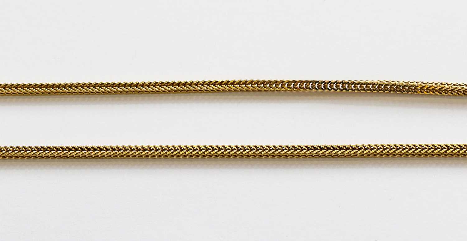 Lot 190 - A fancy link chain, stamped '750', length 61cm