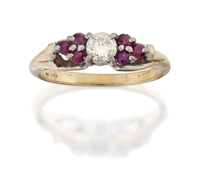 Lot 2056 - A Ruby and Diamond Ring, the round brilliant...