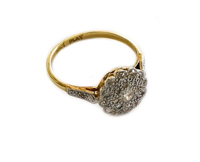 Lot 175 - A diamond cluster ring, stamped '18CT' and...