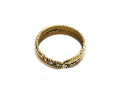 Lot 193 - A diamond crossover ring, unmarked, finger size R