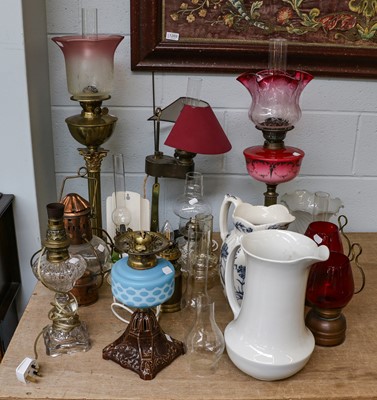 Lot 267 - Three Victorian oil lamps, two with column...