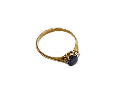 Lot 190 - A sapphire and diamond three stone ring, the...