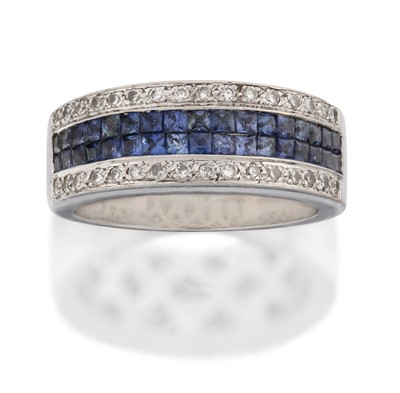 Lot 2041 - A Sapphire and Diamond Half Hoop Ring