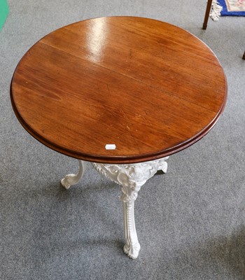 Lot 1164 - A painted cast iron table with circular top,...