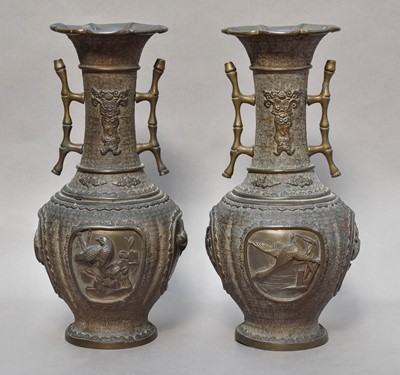 Lot 182 - A pair of early 20th century Japanese bronze...