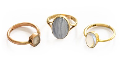 Lot 196 - A moonstone ring, stamped '18', finger size J;...