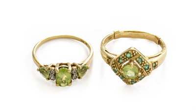 Lot 206 - A peridot and emerald cluster ring, stamped...