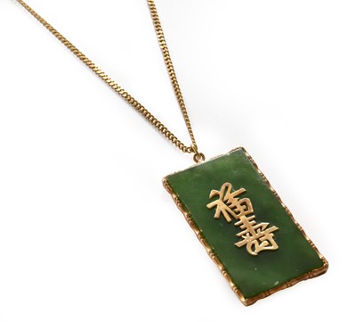 Lot 112 - A nephrite pendant on a 9 carat gold chain,...
