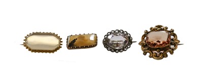 Lot 159 - An amethyst brooch; a topaz brooch; and two...