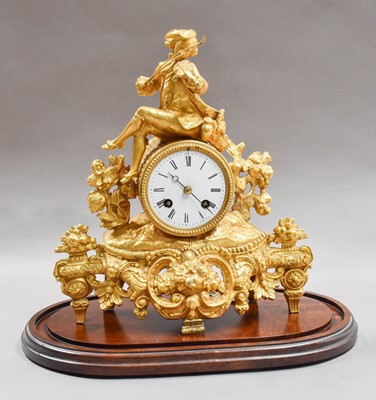 Lot 52 - A Victorian gilt metal striking mantel clock...