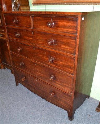 Lot 394 - George III mahogany straight front chest of two short and three long graduated drawers