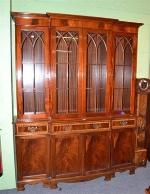 Lot 396 - A reproduction mahogany breakfront bookcase