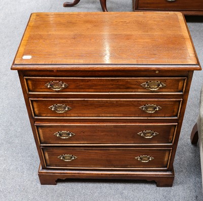 Lot 1265 - A reproduction oak Batchelors chest of four...