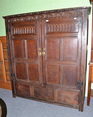 Lot 403 - An oak carved cupboard made up of 17th century panelling