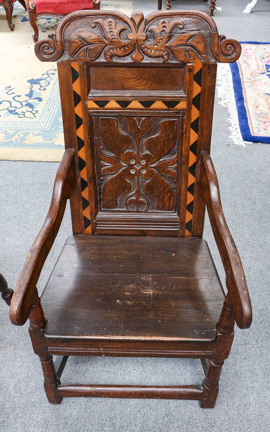 Lot 1165 - A carved oak and inlaid Wainscot chair