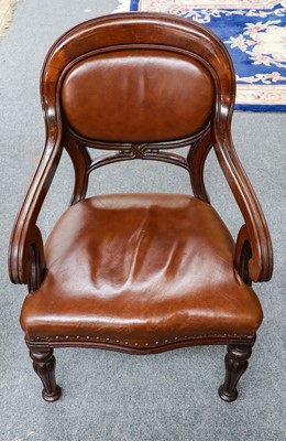 Lot 1178 - A leather and mahogany library chair