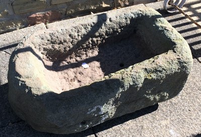 Lot 1112 - A rectangular weathered stone trough, 65cm by...