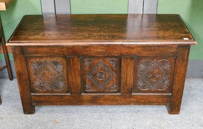 Lot 1126 - Carved oak chest with lozenge panels 122cm by...