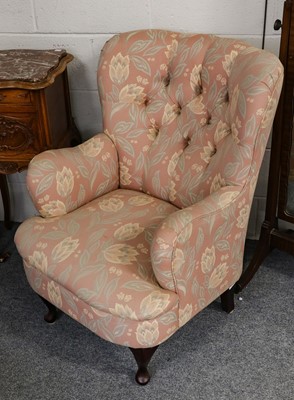 Lot 1081 - A modern button back arm chair