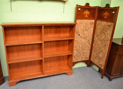 Lot 411 - A small two leaf screen and a modern yew wood open bookcase