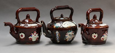 Lot 29 - Three Victorian Bargeware teapots and covers,...