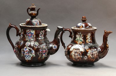 Lot 29 - Three Victorian Bargeware teapots and covers,...