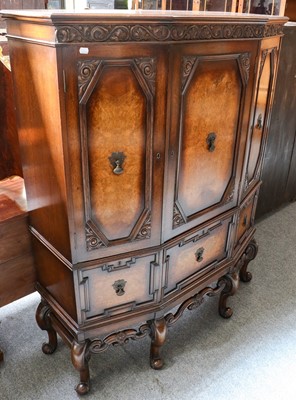 Lot 1221 - A 1920s oak and burr walnut cabinet of...