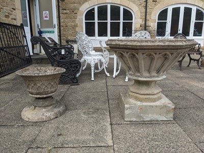 Lot 1102 - A cast stone Gothic style pedestal planter,...