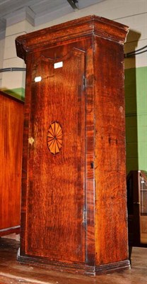 Lot 417 - An 18th century oak hanging corner cupboard (converted from a clock trunk)