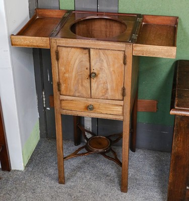 Lot 1125 - A George III mahogany washstand, the top...