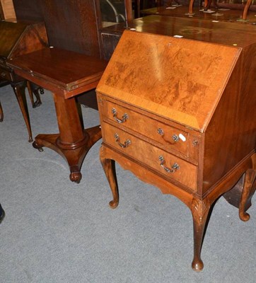 Lot 422 - A mahogany fold-over pedestal tea table with later top and a small walnut bureau