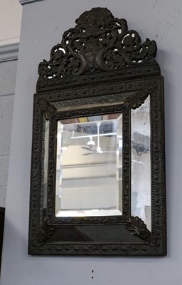 Lot 1234 - A repousse decorated mirror, 35cm by 61cm