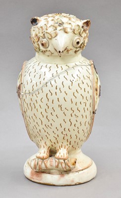 Lot 121 - A 19th century glazed earthenware owl form...