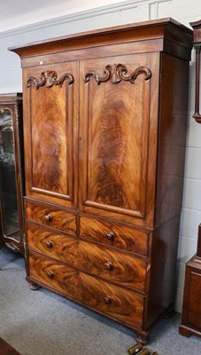 Lot 1237 - A 19th century figured mahogany linen press,...