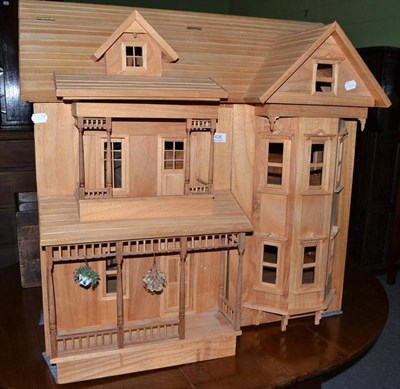 Lot 426 - A modern light wood doll's house